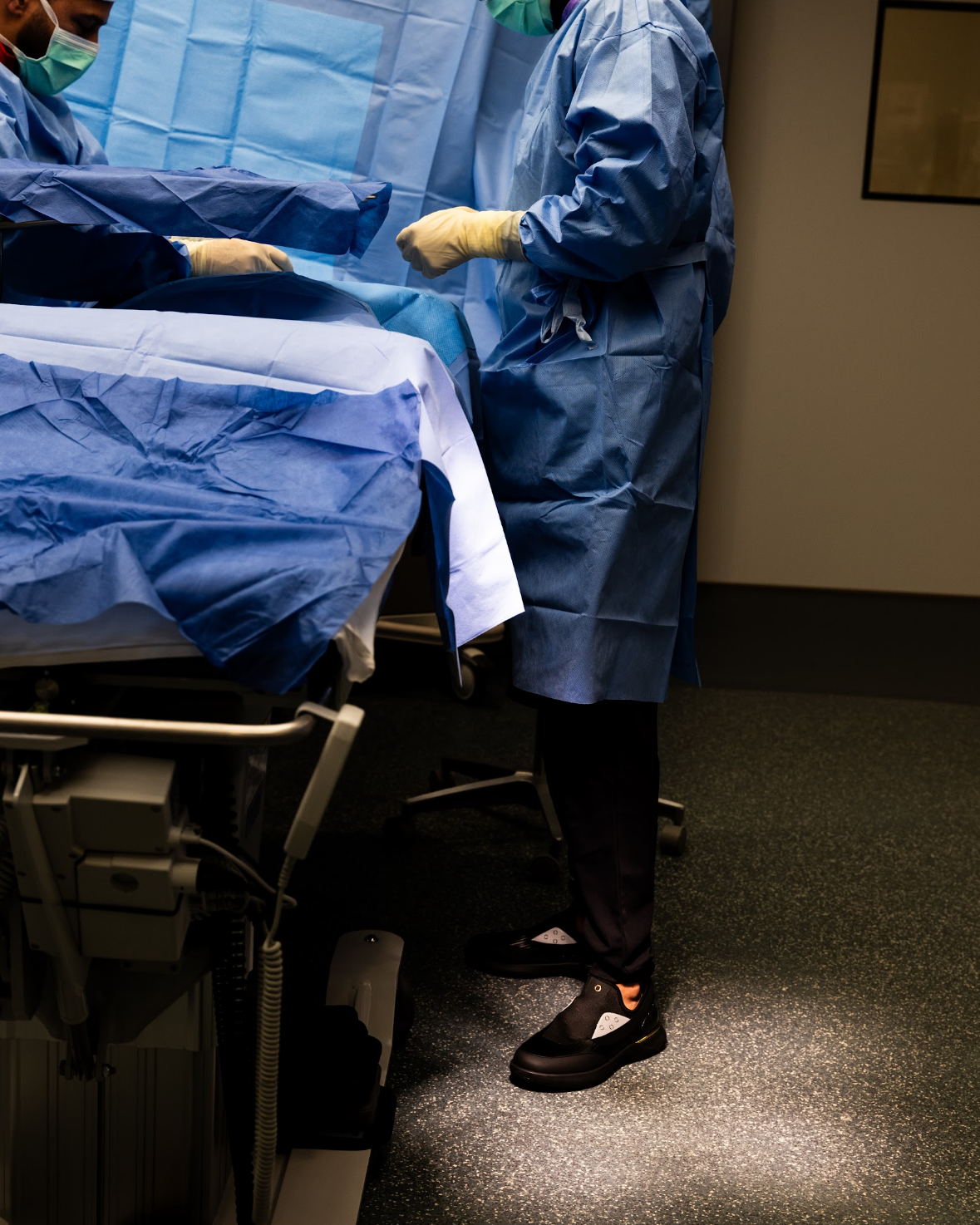 Surgeon in the operating room wearing black Snogs Genesis Night Shift sneakers